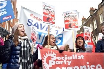 Holding the Socialist Party banner on the 3rd Feb London 'save NHS' demo, photo Mary Finch