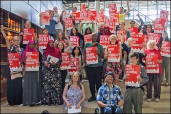 Kshama Sawant (centre) has championed the fight against injustice - pictured here campaigning for socialist housing policies, photo by Socialist Alternative