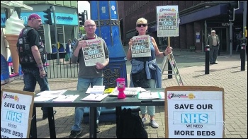 Cait Mallon selling the Socialist, photo Stoke Socialist Party