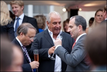 Billionaire retail boss Philip Green (centre) has been accused of racism and sexism towards his workers, photo Financial Times/CC