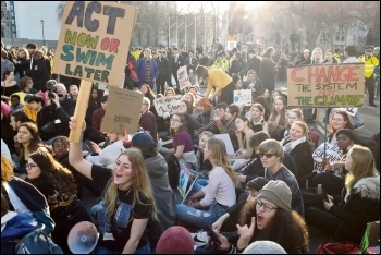 Student climate strikers blocking the road at Parliament Square, photo by James Ivens