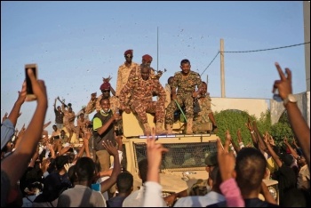 Workers fraternised with soldiers when hardliners in Sudan were preparing a crackdown in April, photo M Saleh/CC