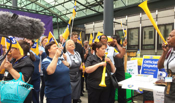 The moment privatised low-paid catering, cleaning, & portering workers walked out on indefinite strike action at the government department for Business, Energy and Industrial Strategy (BEIS), photo Paula Mitchell