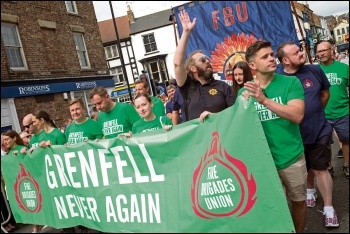 Firefighters marching for fire safety, photo by Paul Mattsson