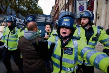 Undercover police crossing police lines in 2011, photo by Paul Mattsson