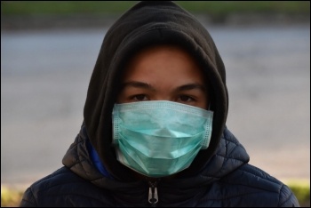 Coronavirus - wearing a protective mask, photo (public domain)