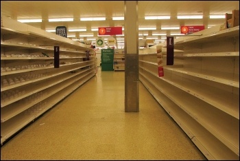 Shelves cleared by profit-hungry supermarkets permitting uncontrolled panic buying, photo by Derek Harper/CC