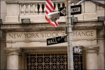 Wall Street gets giveaways while workers get sick, photo by Wagner T Cassimiro/CC