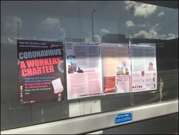 Socialist Party material on the coronavirus crisis displayed outside a building site, March 2020, photo Paula Mitchell