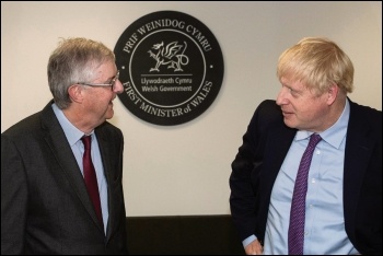 Welsh first minister Mark Drakeford (left) has mostly tailed UK prime minister Boris Johnson (right) on coronavirus strategy, photo OGL v3