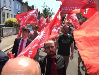 Flying the red flag at Ken Douglas' funeral June 2020, photo Niall Mulholland