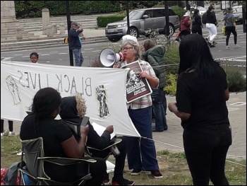 Mira speaking at the protest, photo North London SP