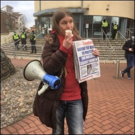 Socialist Party member Mia Hollsing addresses a protest in Cardiff. Photo Socialist Party Wales