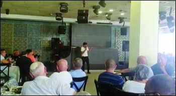 Strike leader Eli Badash addressing a national meeting of reps from 30 hospitals to prepare for the strike Strike leader Eli Badash addressing a national meeting of reps from 30 hospitals to prepare for the strike