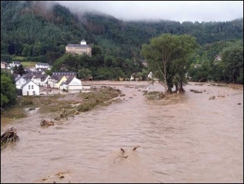 The flooded River Ahr in Altenahr, Germany. Such extreme weather events are becoming the norm under capitalism 