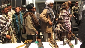 Former Taliban fighters return their weapons 2012