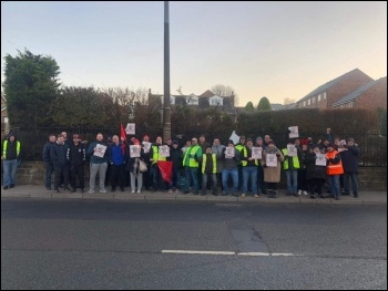 South Yorkshire Stagecoach strikers holding copies of the Socialist on the picket line, photo Alistair Tice