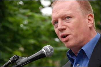 Matt Wrack, FBU general secretary, addressing 2,500 uniformed firefighters who marched with Fire Brigades Union flags and placards to protest outside the London Fire Authority (LFA), photo Suzanne Beishon