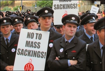 2,500 uniformed firefighters marched with Fire Brigades Union (FBU) flags and placards to protest outside the London Fire Authority (LFA), photo Suzanne Beishon