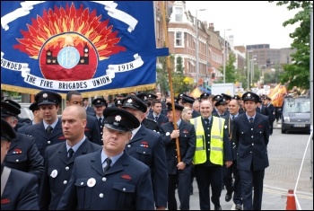 2,500 uniformed firefighters marched with Fire Brigades Union (FBU) flags and placards to protest outside the London Fire Authority (LFA), , photo Suzanne Beishon