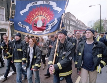 100 striking FBU firefighters led the London October 23rd trade union led demonstration against the cuts, photo Paul Mattsson