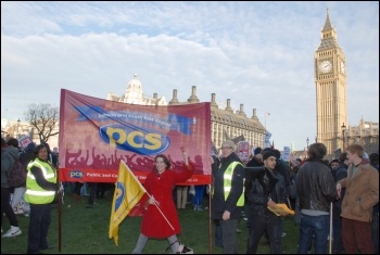 A public sector union banner (PCS) on student demonstration protesting outside parliament on Day X as tuition fees debated, photo Suzanne Beishon