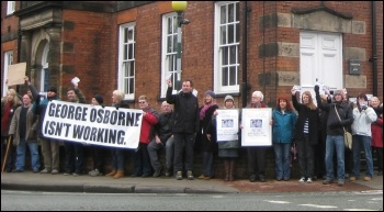 Around 100 people gathered outside the offices in Knutsford, Cheshire where George Osborne is the MP, photo by Hugh Caffrey Around 100 people gathered outside the offices in Knutsford, Cheshire where George Osborne is the MP, photo by Hugh Caffrey