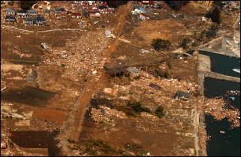 Japan: earthquake and tsunami: an aerial view of tsunami damage in Tōhoku, photo Wikipedia
