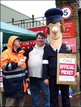 Postman Pat joins the CWU picket line in East London, photo Naomi Byron