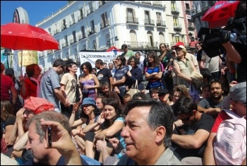 Madrid: Spain’s town squares filled with tens of thousands of indignados (angry people), mainly youth, in protest at the anti-social consensus of both PSOE and the PP , photo Sarah Wrack