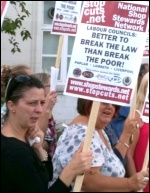 Better to break the law than break the poor: National Shop Stewards Network placard, photo Senan