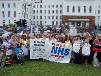 100 health workers came out in a lunchtime protest against the potential loss of over 100 posts at St Helier hospital in south London on Wednesday 27 July 2011, photo Chris Newby