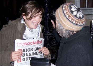 Socialist Party members sell The Socialist, photo Paul Mattsson