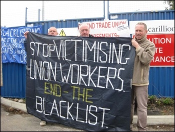 Manchester electricians protesting on 31.8.11 as part of protests around the country against the employers' assault on pay and conditions. Simon, Steve and Sean (from left to right) leafleted outside the Carillion site in Denton, Manchester. Photo Hugh C.