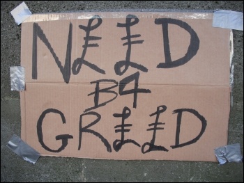 A homemade placard  at an anti-capitalist protest in 2011, photo Elaine Brunskill