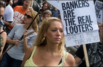 Bankers are the real looters: placard on Hackney - Tottenham demo after the riots , photo by Paul Mattsson