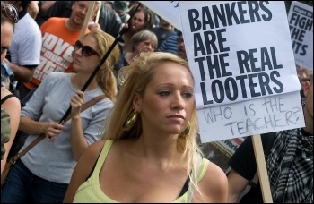 Bankers are the real looters: placard on Hackney - Tottenham demo after the riots , photo Paul Mattsson