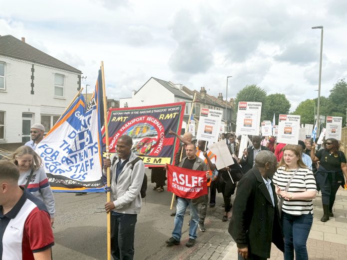 Striking Mitie workers march with rail strikers to a rally at King's Cross. Photo: Deji Olayinka