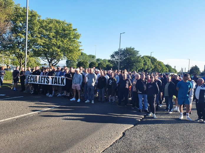 Workers walk out in Grangemouth, Scotland. Photo: Phillip Stott