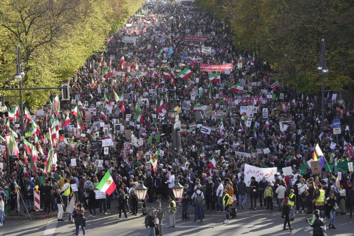 People attend a protest against the Iranian regime, in Berlin, Germany, - photo Markus Schreiber