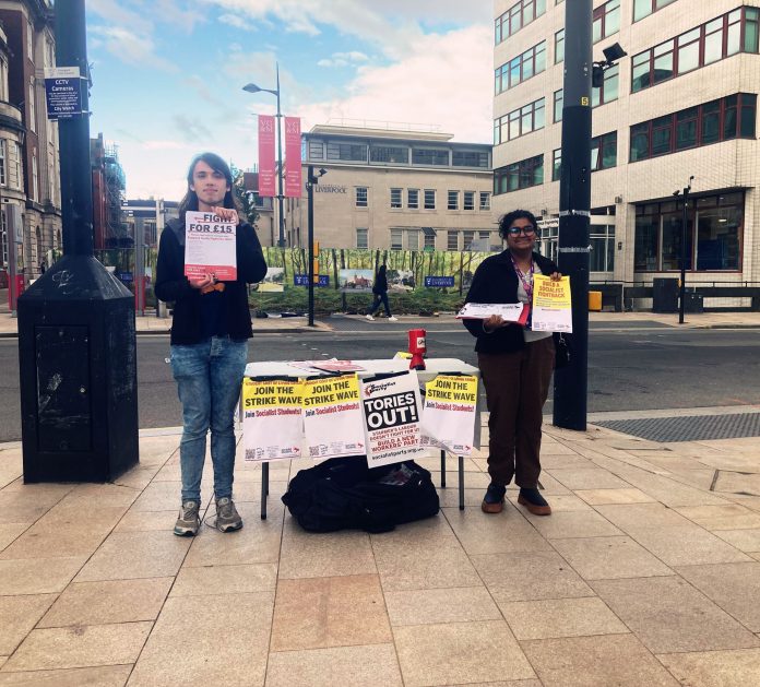 Annanya and Henry from Edge Hill help Liverpool Socialist Students. Photo: Alex Smith