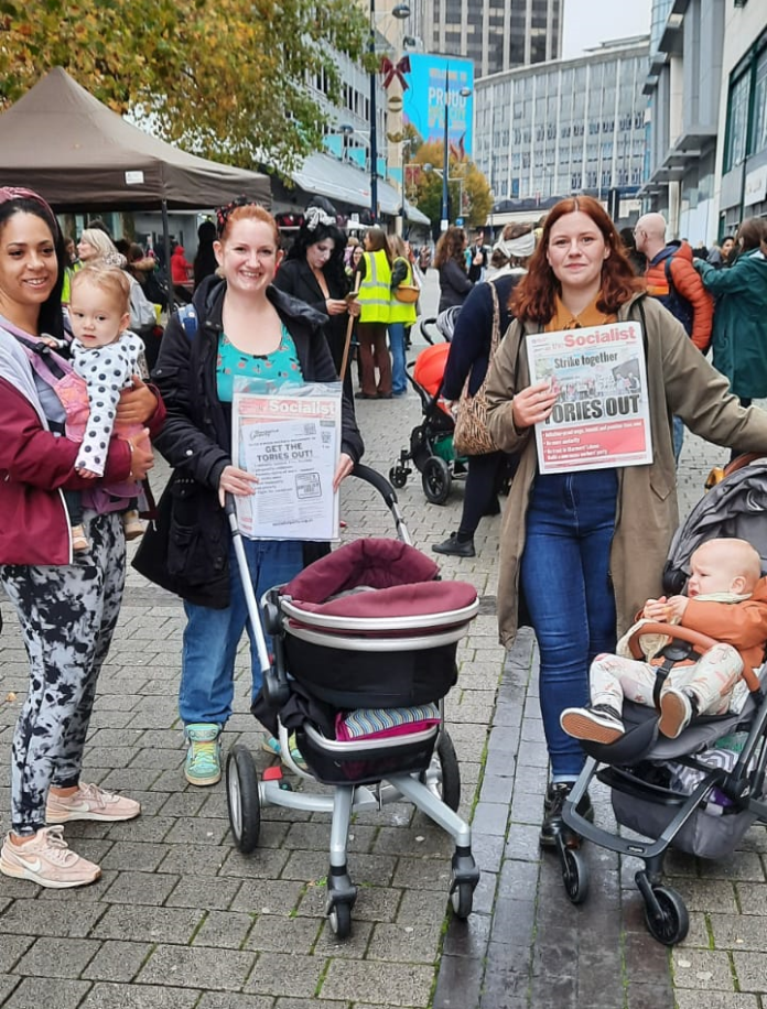 Katie (centre) and Corinthia (right) at the protest in Birmingham