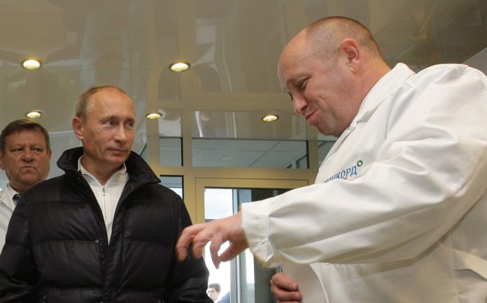 Vladimir Putin (left) and Yevgeny Prigozhin (right) Photo: Government of the Russian federation /CC