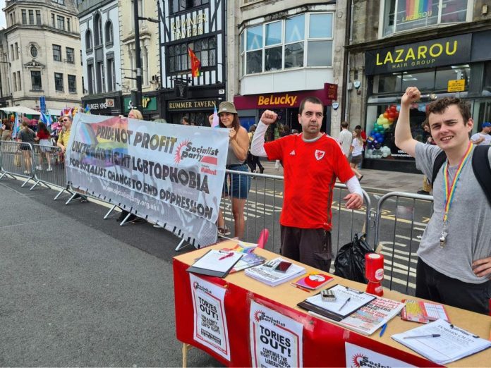 cardiff pride "Pride not profit - Unite to fight LGBTQphobia - For Socialist change to end oppression" read the Socialist Party banner at Cardiff Pride. Photo: Cardiff SP