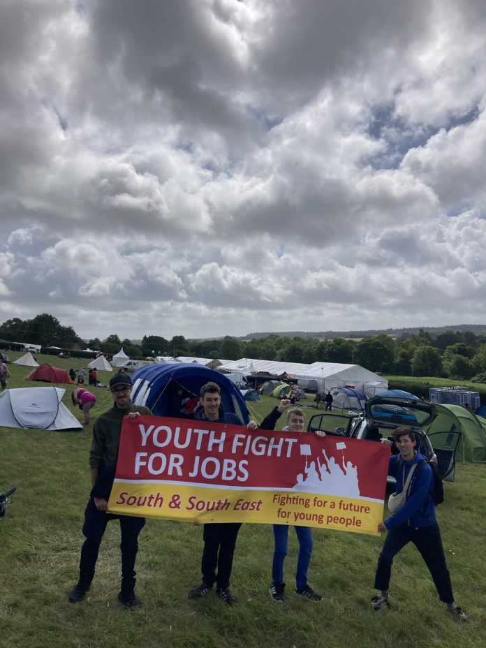Youth Fight for Jobs campaigners before the wind and rain at Tolpuddle festival. Photo: YFJ