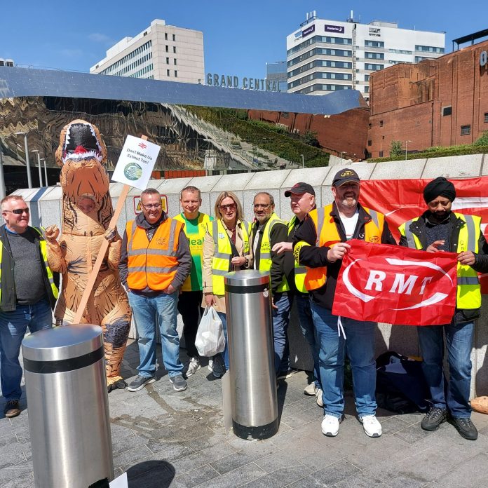 'Don't make us extinct too' placard at RMT picket line. Photo: Brum SP