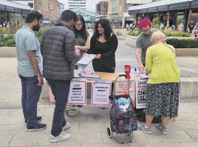 Mila (middle) campaigning in Coventry