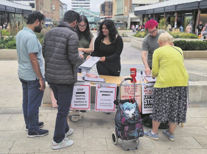 Cov city centre Sept 2022 Mila (middle) campaigning in Coventry