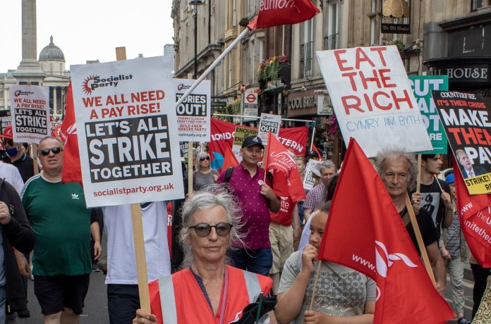 Strike together placard. Photo: Tommy Liverpool