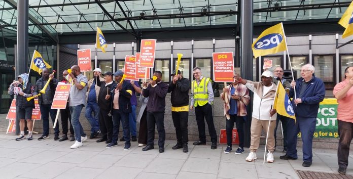 PCS members in three Whitehall departments (formerly BEIS), working for private company ISS, on strike against a 2.2% pay offer and demanding to be brought back in-house. Marion is PCS BEIS group president. Photo: Rob Williams